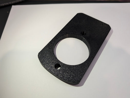 Black spacer plate for Salto XS4 Mini ANSI, flat overhead view with cylinder aperture and fixing screw holes